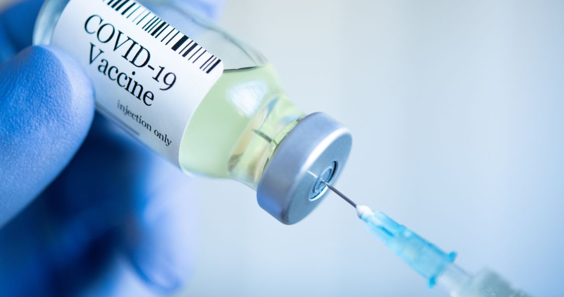 Needle in a vial of COVID-19 Vaccine