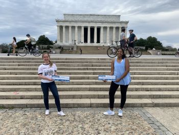 Students on the National Mall with Match Day signs