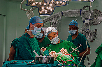 Walter Jean conducting surgery 